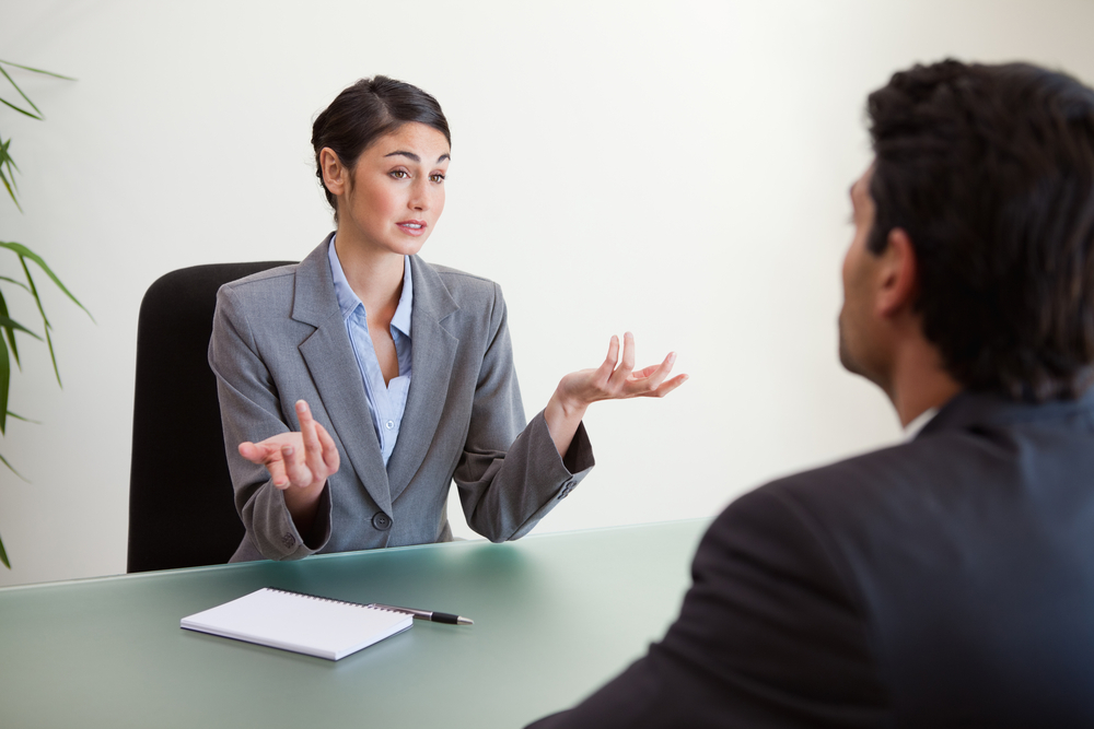 Manager interviewing her candidate in an office